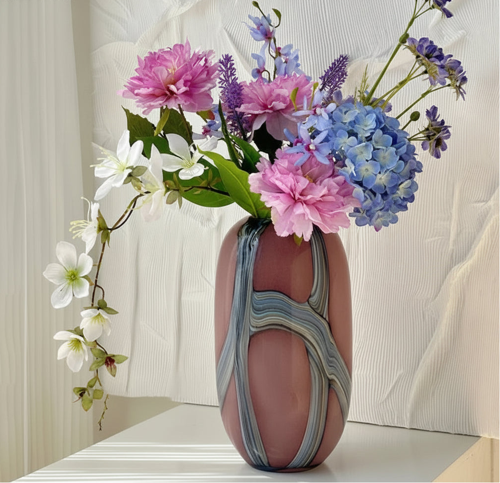 Marbled pink and gray vase with flowers on a white background